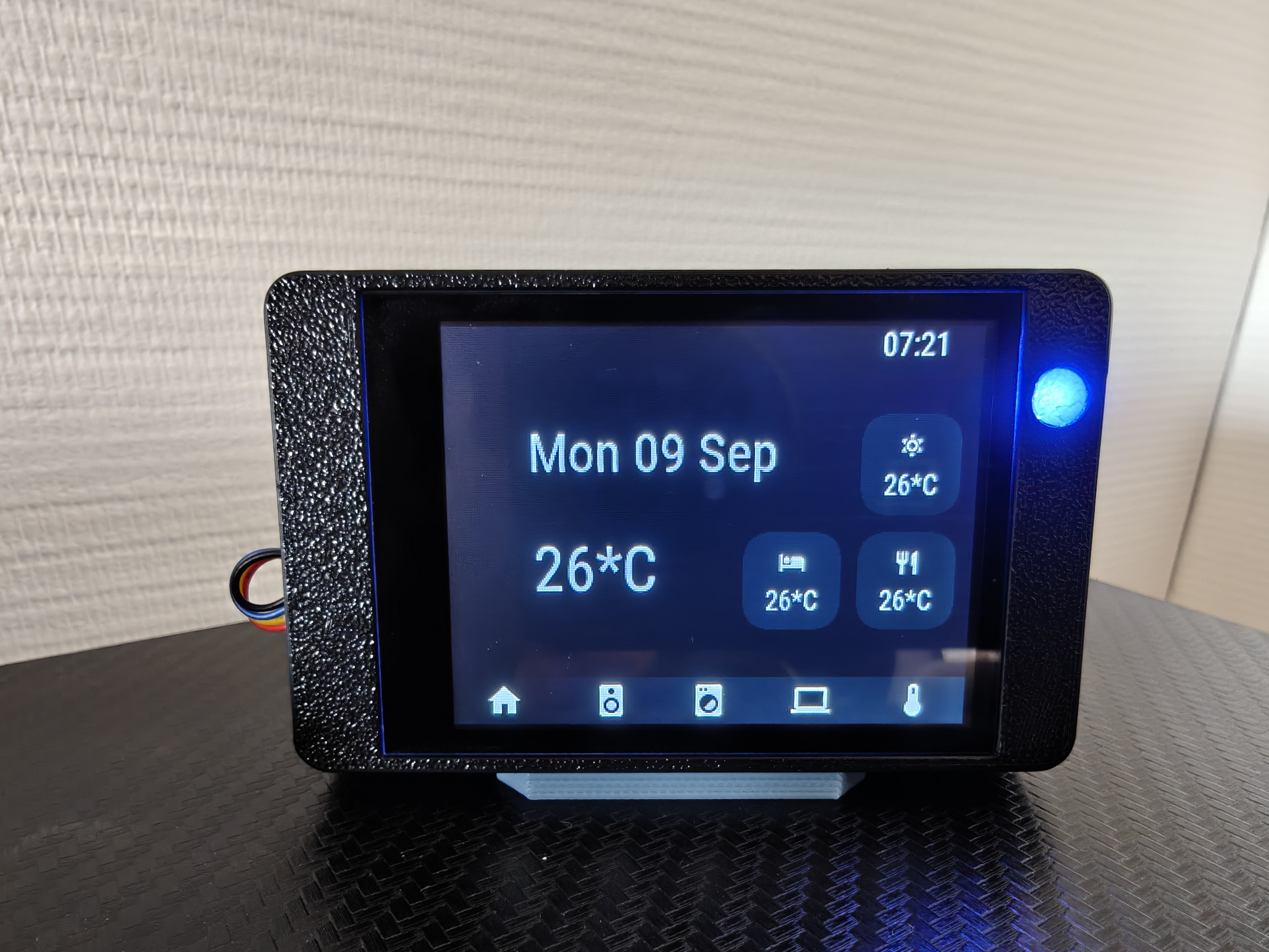 Guition JC2432W328 desk display photographed on my desk, running openHASP